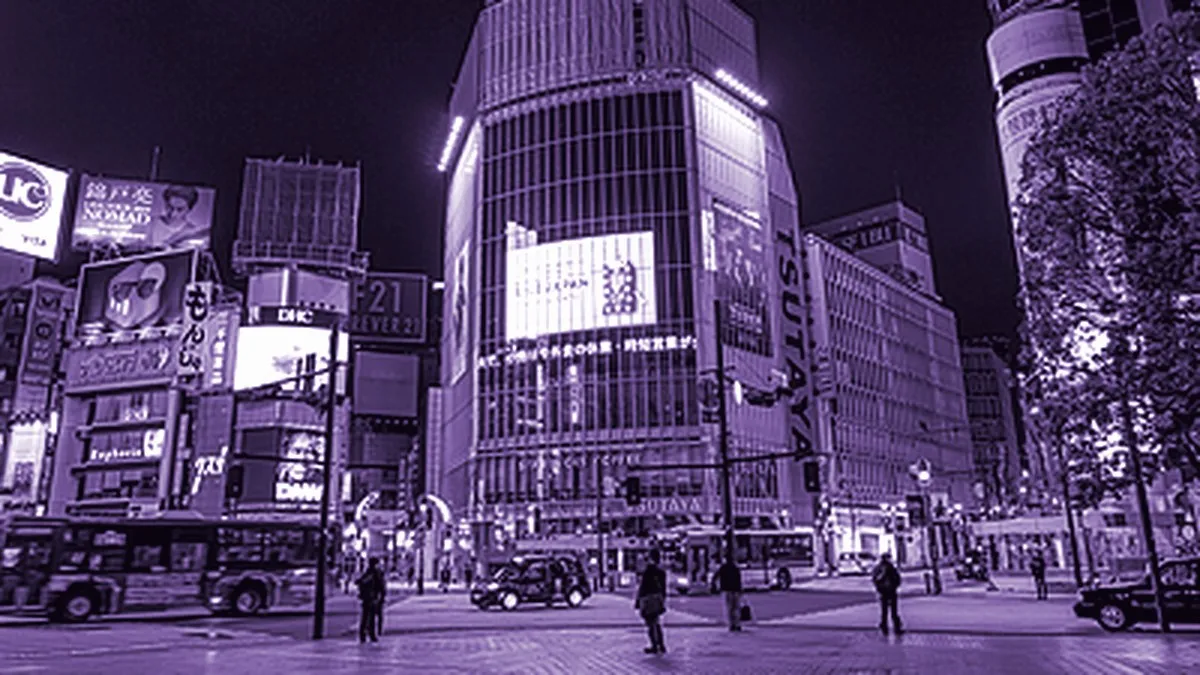 Tokyo, Japan — Shibuya Crossing at night under its neon billboards